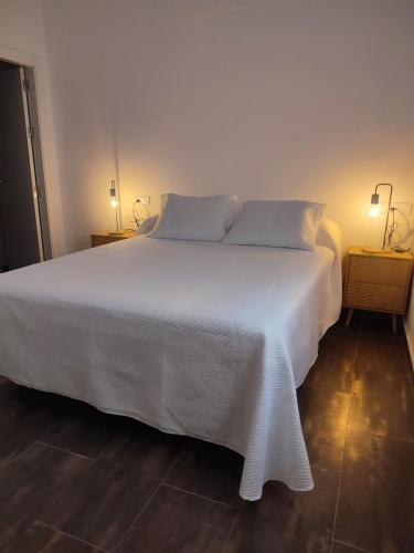 Ένα ή περισσότερα κρεβάτια σε δωμάτιο στο Duplex con vistas en el centro de Aracena