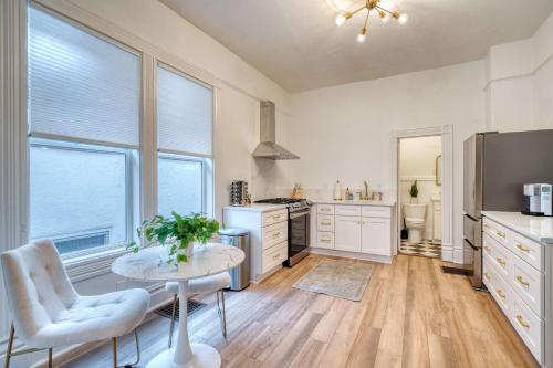 a large kitchen with a table and a refrigerator at Stay Portland - Historic Queen Anne Vernacular - 95 WalkScore in Portland