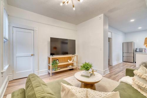 a living room with a couch and a table at Stay Portland - Historic Queen Anne Vernacular - 95 WalkScore in Portland