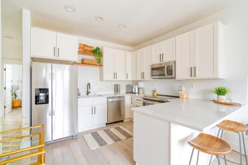 a kitchen with white cabinets and a white counter top at Stay Portland - Perfect Portland Farmhouse Loft - Breweries & Bars in Portland