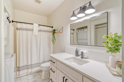 a white bathroom with a sink and a mirror at Stay Portland - Perfect Portland Farmhouse Loft - Breweries & Bars in Portland