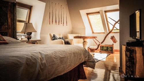 a bedroom with a bed and a tv in it at Villa Nao in Roxton Falls