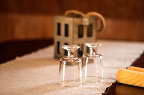 two clear wine glasses sitting on top of a table at Hof Seebrookquelle in Schlesen