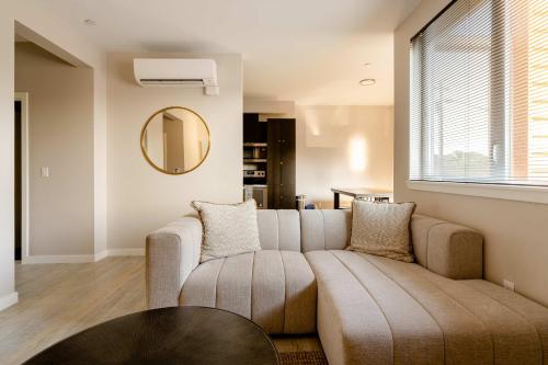 a living room with a couch and a table at Stay Portland - Modern Home in Foodie District - 2BR - Sleeps 4 in Portland