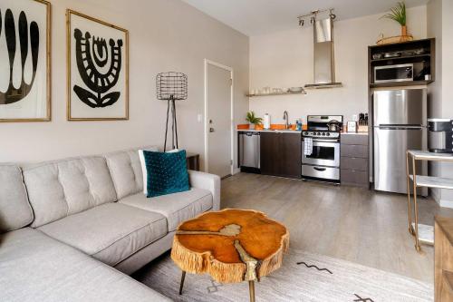 a living room with a couch and a table at Stylish Portland 1BR w 90 WalkScore in Portland