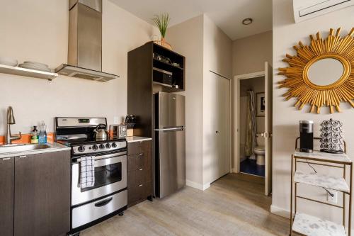 a kitchen with a stove and a sink at Stylish Portland 1BR w 90 WalkScore in Portland