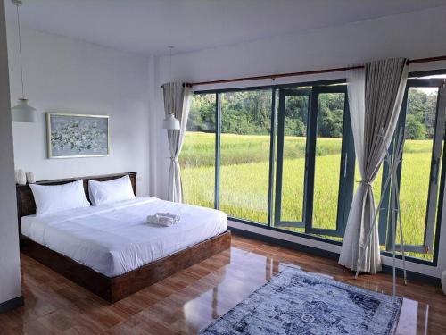 Cama o camas de una habitación en Chan Rak Khao Villa ฉันรักเขาวิลล่า