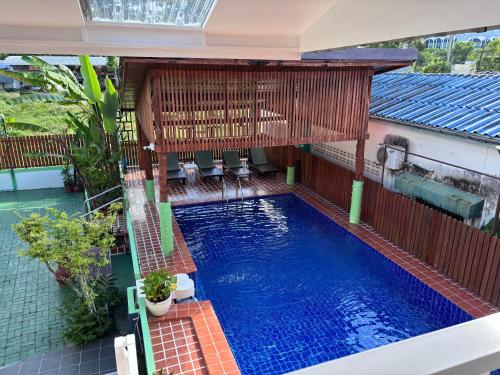 an overhead view of a swimming pool in a house at The Golden Beach Resort Naiyang in Nai Yang Beach