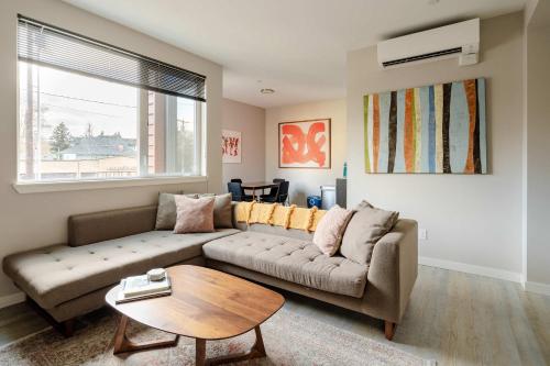 a living room with a couch and a table at Stay Portland - The Mid-Century Cabin in Portland - Thrift & Eat in Portland