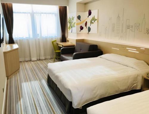Postel nebo postele na pokoji v ubytování West Hotel