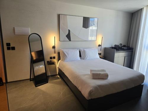 a bedroom with a large bed in a hotel room at Thirty Three Boutique -Adults Only By K Hotels in St Julian's