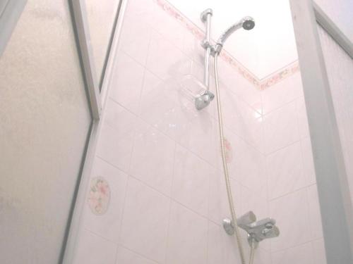 a shower with a glass door in a bathroom at Sagarika Beach Hotel in Moragalla