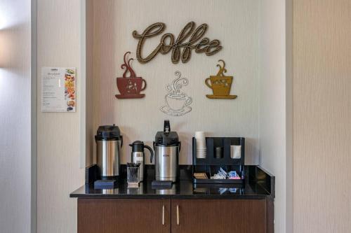 a coffee station with a coffee sign on a wall at Cambria Hotel Ft Lauderdale, Airport South & Cruise Port in Dania Beach