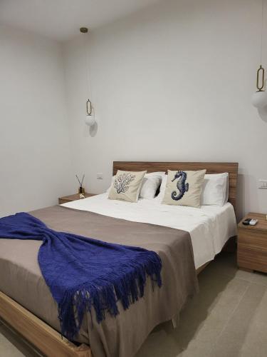 Ένα ή περισσότερα κρεβάτια σε δωμάτιο στο Dea Marinae vacation house