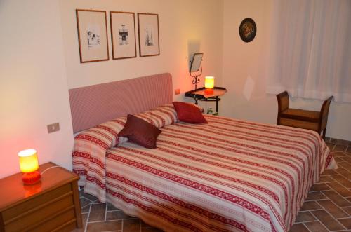 A bed or beds in a room at Agriturismo Sant'Alfredo