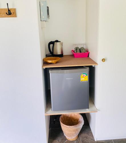 a kitchen with a small refrigerator in a room at The1 Mangosteen Harmony Retreat - Khaolak - Eco Luxury Villa - Room Only -No Breakfast in Khao Lak