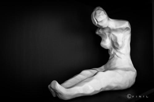 a white statue of a man sitting with his legs crossed at Villa Nao in Roxton Falls