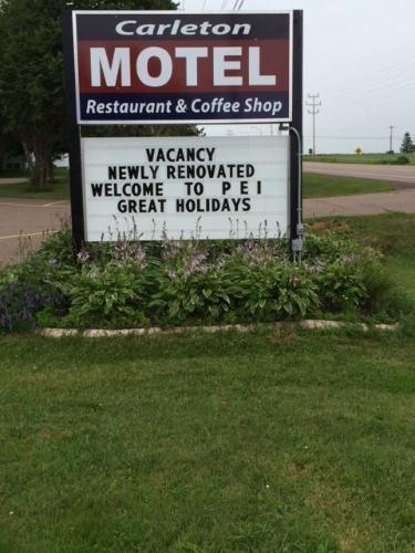 a sign for a motel restaurant and coffee shop at Carleton Motel and Coffee Shop in Borden-Carleton