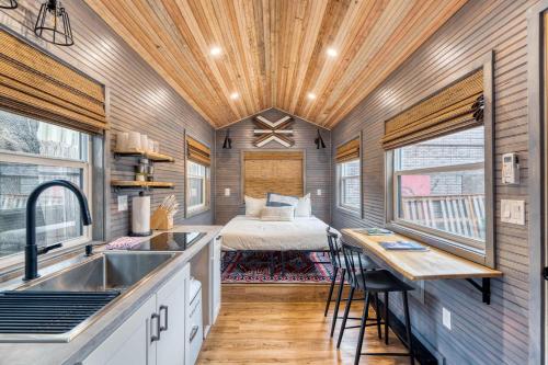 a kitchen with a sink and a bed in a room at Stay Portland - Tiny Aztec - Walk to Local Shops & Restaurants in Portland
