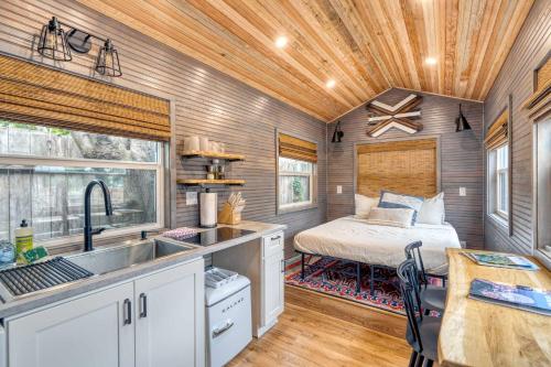 a kitchen and bedroom in a tiny house at Stay Portland - Tiny Aztec - Walk to Local Shops & Restaurants in Portland