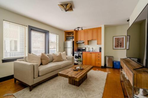 a living room with a couch and a coffee table at Stay Portland - The Little Tower - Local Vintage Shops & Eateries in Portland