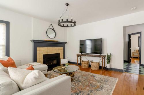 a living room with a couch and a fireplace at Stay Portland - Spacious Restored Craftsmen - Craft Beer & Coffee in Portland