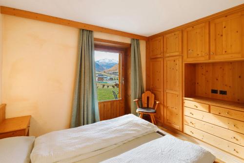 Postel nebo postele na pokoji v ubytování Piccolo Larice - Livigno