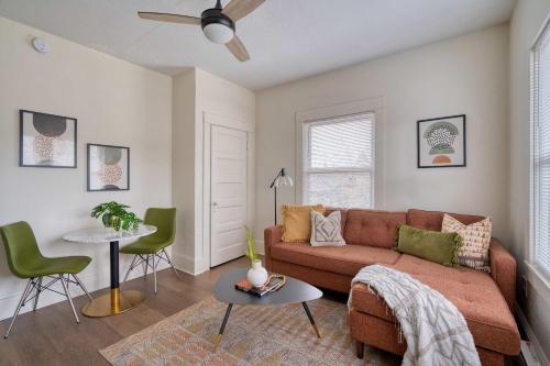a living room with a couch and a table at Stay Portland - Mt Tabor Retreat - Local Eateries - Shops - Bars in Woodstock