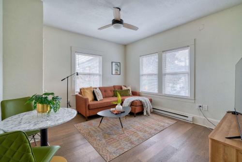 a living room with a couch and a table at Stay Portland - Mt Tabor Retreat - Local Eateries - Shops - Bars in Woodstock