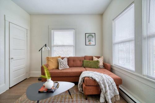 a living room with a couch and a table at Stay Portland - Mt Tabor Retreat - Local Eateries - Shops - Bars in Woodstock