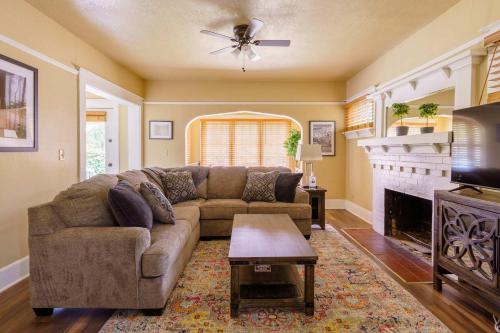 a living room with a couch and a fireplace at Stay Portland - Heart of Portland! Newly Remodeled, 99 Walk Score in Portland