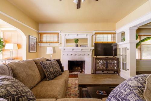 a living room with a couch and a fireplace at Stay Portland - Heart of Portland! Newly Remodeled, 99 Walk Score in Portland