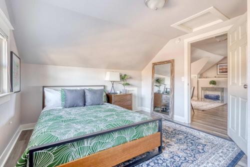 a bedroom with a bed and a mirror at Stay Portland - Luxury Portland Gem! 99 Walk Score, New Remodel in Portland