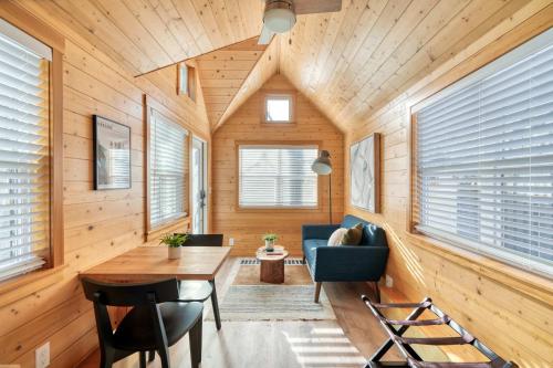 a living room with wooden walls and a wooden ceiling at Stay Portland - Tiny Refuge - Quiet & Cozy in Woodstock