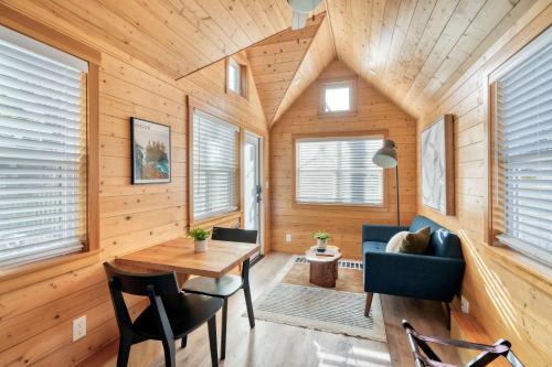 a room with a table and chairs and wooden walls at Stay Portland - Tiny Refuge - Quiet & Cozy in Woodstock