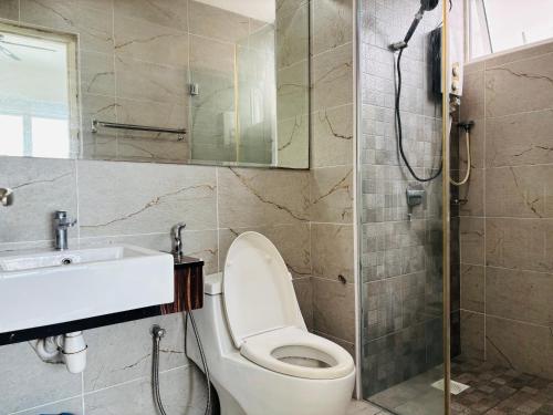a bathroom with a toilet and a sink and a shower at GYDEN STAYCATION #Pinnacle Tower at JB City Centre in Johor Bahru