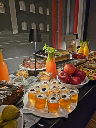 a buffet of food and drinks on a table at Quality Silesian Hotel in Katowice