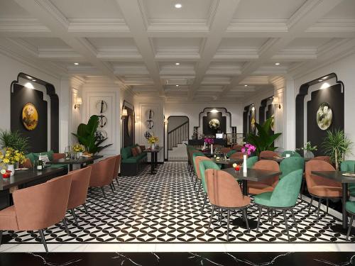 a restaurant with couches and tables and chairs at Light Vesper Premium Hotel & Sky Bar in Ho Chi Minh City