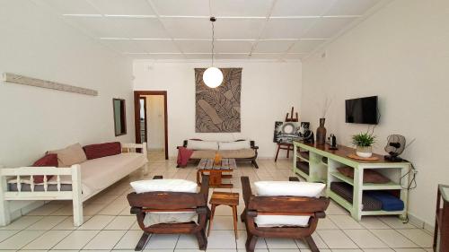 a living room with a couch and a table at Family Retreat Holiday Home in Margate