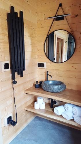 a bathroom with a sink and a mirror at Sruby u potoka in Malá Morava