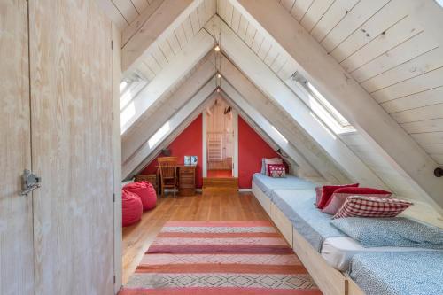 a room with a bed in the attic at Magnifico duplex en centro Viella in Vielha