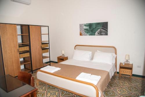 Ένα ή περισσότερα κρεβάτια σε δωμάτιο στο Antico Giardino Salentino