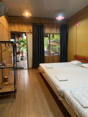 a bedroom with a large bed in a room at An Homestay Tam Coc in Ninh Binh