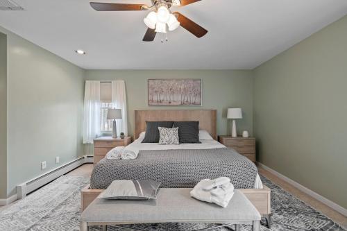 a bedroom with a bed and a ceiling fan at Modern Country Retreat near Legoland w Backyard in Chester