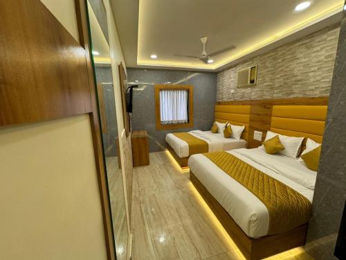 Ένα ή περισσότερα κρεβάτια σε δωμάτιο στο New Hotel National