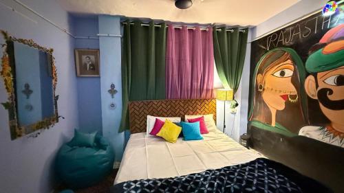 a bedroom with a bed with a painting on the wall at Ghumakkad Jodhpur in Jodhpur