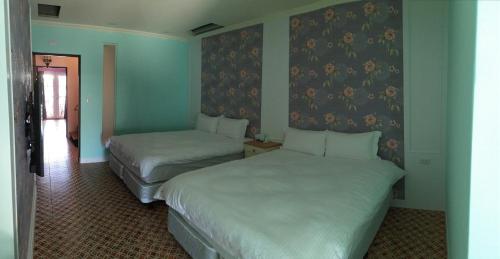 Katil atau katil-katil dalam bilik di Pretty Nanwan B&B