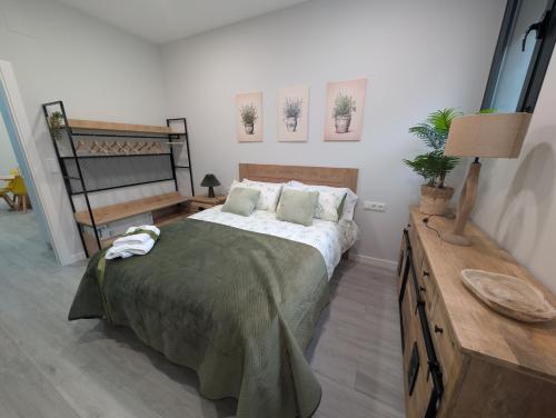 Ένα ή περισσότερα κρεβάτια σε δωμάτιο στο Apartamento Turistico NC