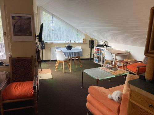 a living room with a dog laying on a couch at Helles Apartment mit Balkon in ruhiger Lage in Hameln