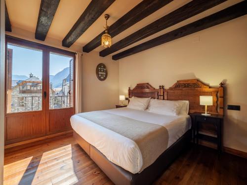Postel nebo postele na pokoji v ubytování Villa de Plan Apartments&Suites